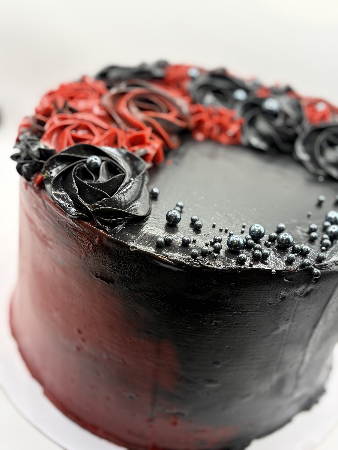 Black and red buttercream rose cake